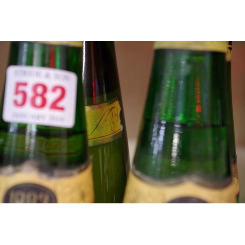 582 - Three 37.5cl bottles of 1983 Hugel Riesling Reserve Personelle; together with one 75cl bottle of 198... 