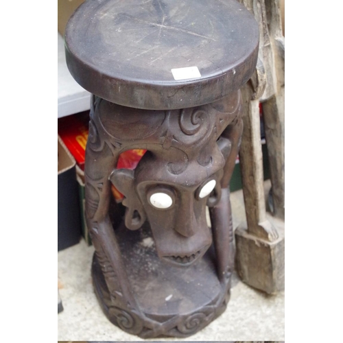 1050A - Ethnographica: two tribal figural stools, largest 51cm high; together with another multi leg stool; ... 