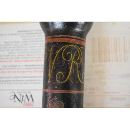 1699 - A 19th century painted and ebonized truncheon, with VR cipher and dated 1817, 41.5cm long.... 