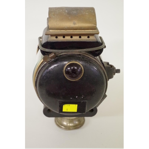 501 - An early 20th century brass and blackened metal oil headlamp, height including handle 31cm.... 