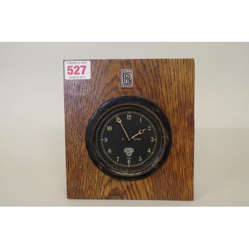 527 - A vintage Smiths dashboard clock, the 3in dial numbered P-271.821, in oak mount with Rolls-Royce pla... 