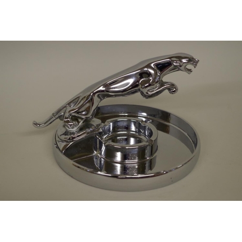 569 - A Jaguar Cars chrome plated leaping cat ashtray, 12cm high.