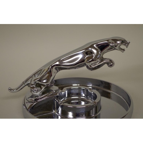 569 - A Jaguar Cars chrome plated leaping cat ashtray, 12cm high.