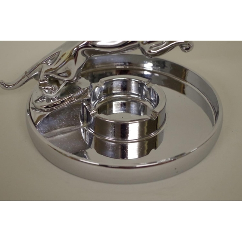 569 - A Jaguar Cars chrome plated leaping cat ashtray, 12cm high.