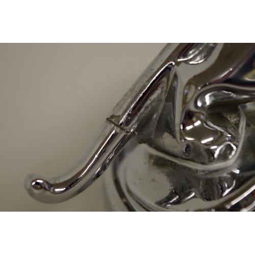 569 - A Jaguar Cars chrome plated leaping cat ashtray, 12cm high.