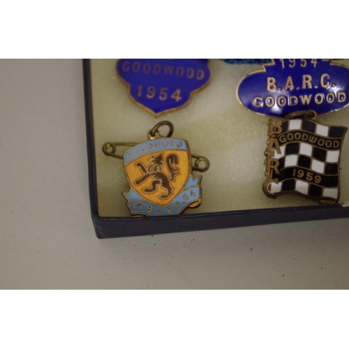 571 - Goodwood: seven enamel B.A.R.C. badges, comprising: 1954, with pendant; 1959, with pendant; 1962; 19... 