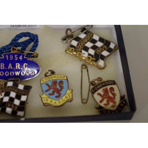 571 - Goodwood: seven enamel B.A.R.C. badges, comprising: 1954, with pendant; 1959, with pendant; 1962; 19... 