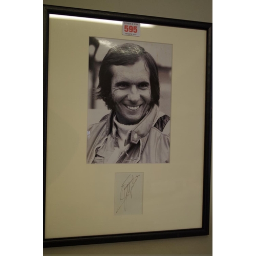 595 - Photographs: a black and white image of Emerson Fittipaldi, signed to reserved margin in mount,... 