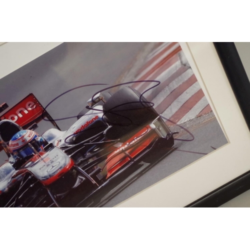 597 - Photographs: a colour image of Jensen Button in McLaren, signed, image 19 x 30cm.... 