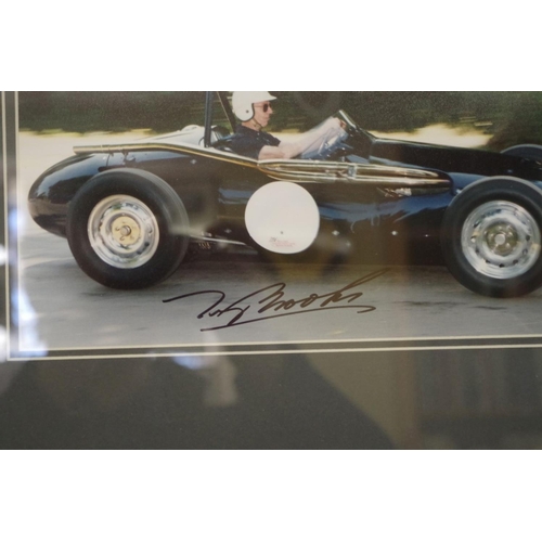 601 - Photographs: a colour image of Tony Brooks in vintage Grand Prix car, signed, 14 x 29.5cm. ... 