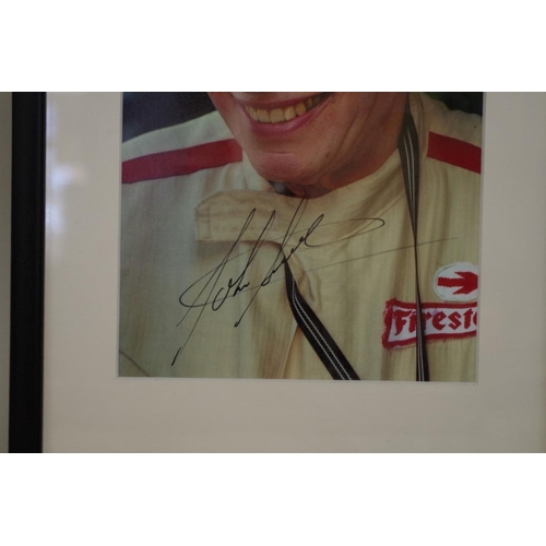 602 - Photographs: a colour image of John Surtees, signed, image 22 x 14.5cm. 