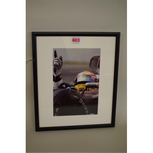 603 - Photographs: a colour image of Lewis Hamilton in Mercedes, signed, image 22 x 15cm.