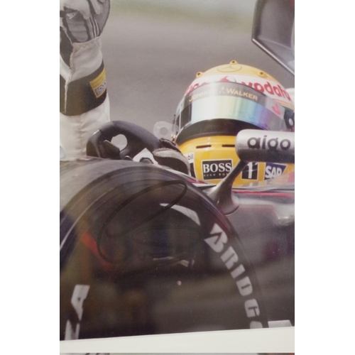 603 - Photographs: a colour image of Lewis Hamilton in Mercedes, signed, image 22 x 15cm.