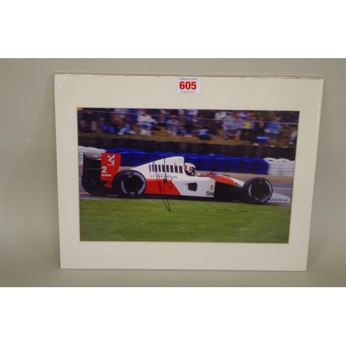 605 - Photographs: a colour image of Gerhard Berger in McLaren Honda, signed, image 19 x 29.5cm, mounted b... 