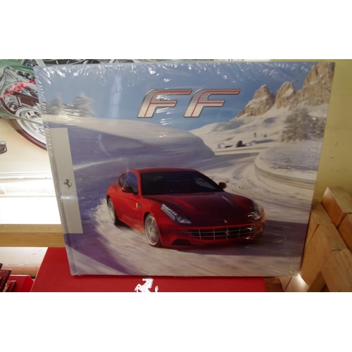 637 - Ferrari: an FF red leather 'New Owner's Welcome Pack', with branded drawstring dust bag, boxed; toge... 