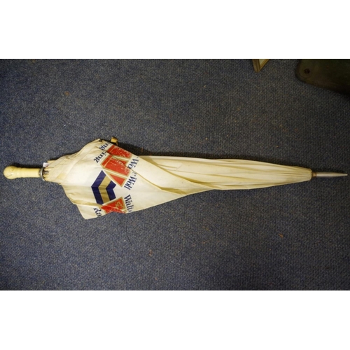 658 - A Walter Wolf Racing umbrella.