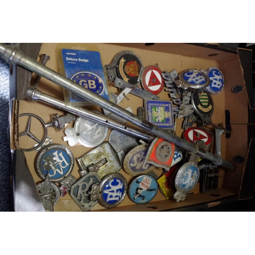 673 - A collection of car radiator badges and related. 