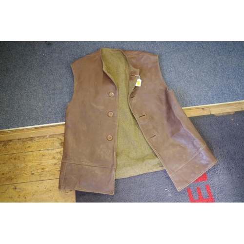 683 - A vintage brown leather jerkin.