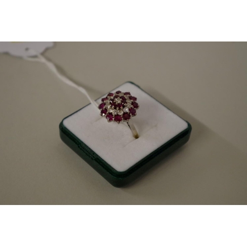 105 - An unmarked diamond and garnet cocktail cluster ring, 7g all in.