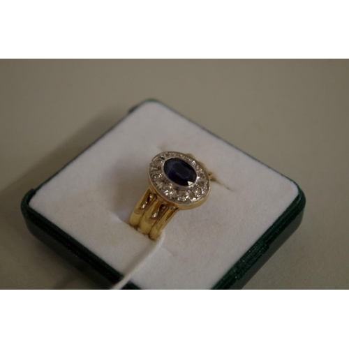 106 - An 18ct gold sapphire and diamond ring.