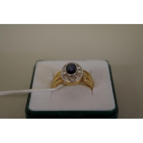 106 - An 18ct gold sapphire and diamond ring.