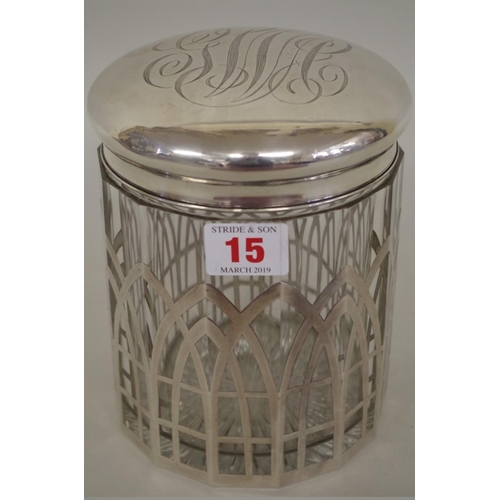 15 - An unusual sterling silver mounted glass oversized biscuit barrel, 17cm.