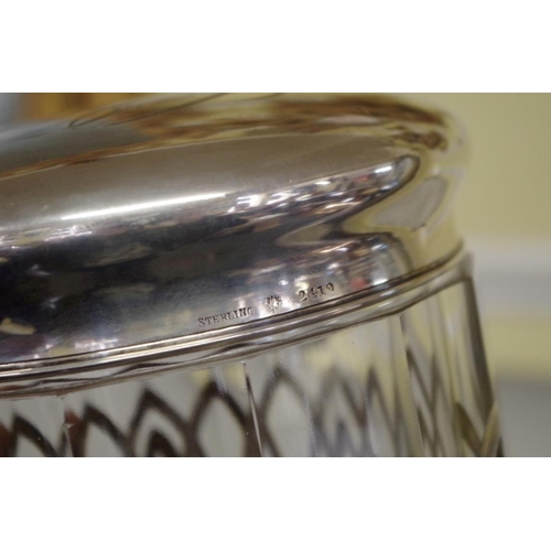 15 - An unusual sterling silver mounted glass oversized biscuit barrel, 17cm.