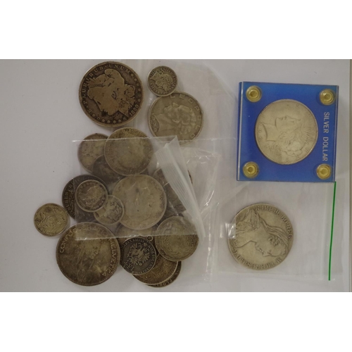 203 - A quantity of British and World silver coins; to include a US dollar, 1880 and a German States two m... 