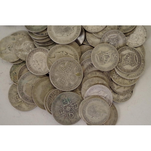 205 - A quantity of pre-1947 shillings and florins, George V and George VI, 1920-1946, 590g.... 