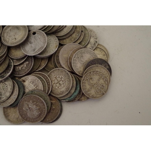 206 - A quantity of pre-1947 British three penny coins, Victoria to George lV, 355g.