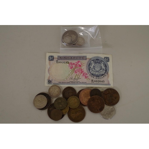 210 - Seven British and World silver coins; together with a small quantity of other coins to include an 18... 