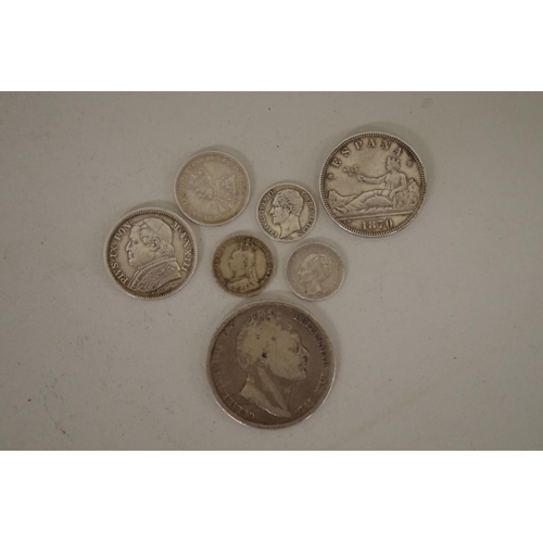 210 - Seven British and World silver coins; together with a small quantity of other coins to include an 18... 