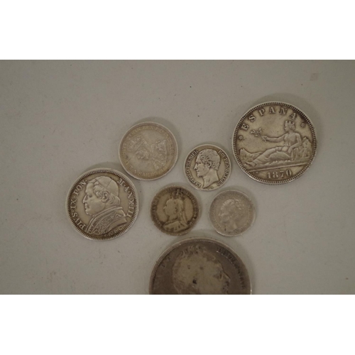 210 - Seven British and World silver coins; together with a small quantity of other coins to include an 18... 