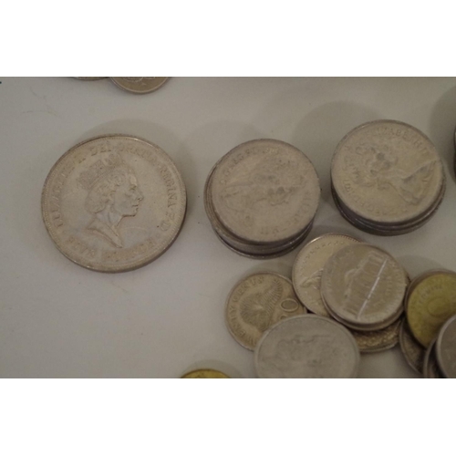 214 - A quantity of British and World coins; to include an Elizabeth II £5 coin, 1990.