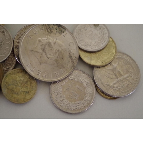 214 - A quantity of British and World coins; to include an Elizabeth II £5 coin, 1990.