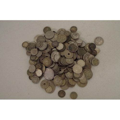 215 - A quantity of World coins; to include examples from The Straights Settlement; Canada; and the USA.... 