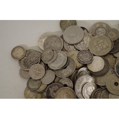 215 - A quantity of World coins; to include examples from The Straights Settlement; Canada; and the USA.... 