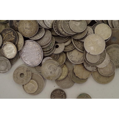 215 - A quantity of World coins; to include examples from The Straights Settlement; Canada; and the USA.... 