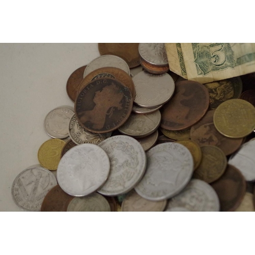 218 - A quantity of 20th century World coins and banknotes.