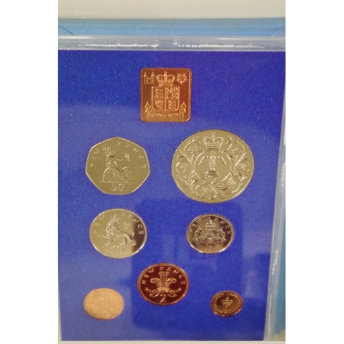 222 - Three cased British decimal coin sets, 1970, 1971 and 1977; together with a silver proof Guernsey Ro... 