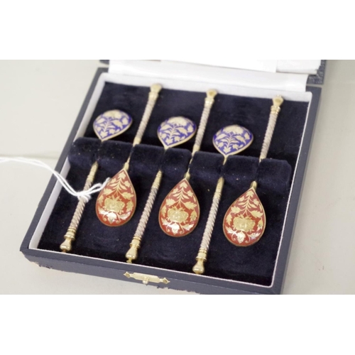 28 - A cased set of six Russian silver gilt and enamel coffee spoons, by S Stroganov, Moscow.... 