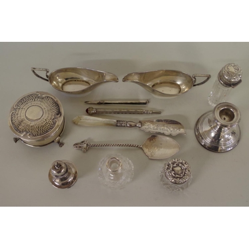 66 - A group of silver items, to include a pair of small sauce boats, Birmingham 1905 and a silver ring c... 