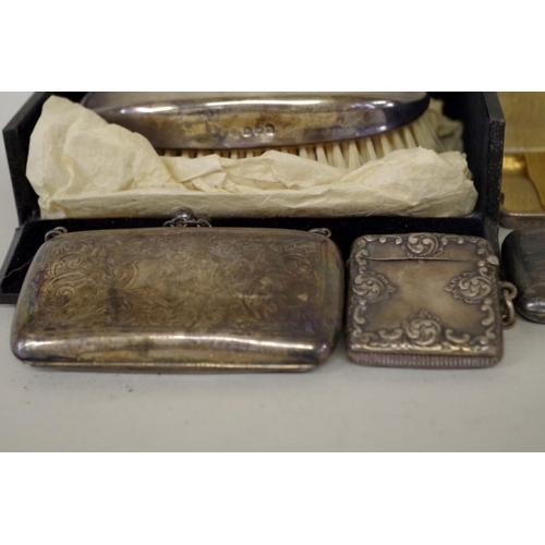 68 - An Edwardian silver purse, by F H L, Birmingham 1915; three silver cigarette cases; and three other ... 