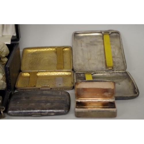 68 - An Edwardian silver purse, by F H L, Birmingham 1915; three silver cigarette cases; and three other ... 