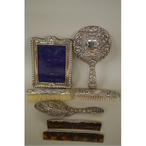 71 - A silver photograph frame; together with various silver mounted dressing table items. (7)... 