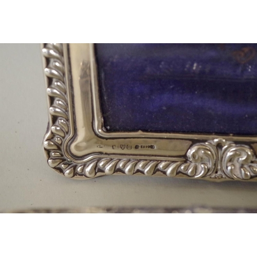 71 - A silver photograph frame; together with various silver mounted dressing table items. (7)... 