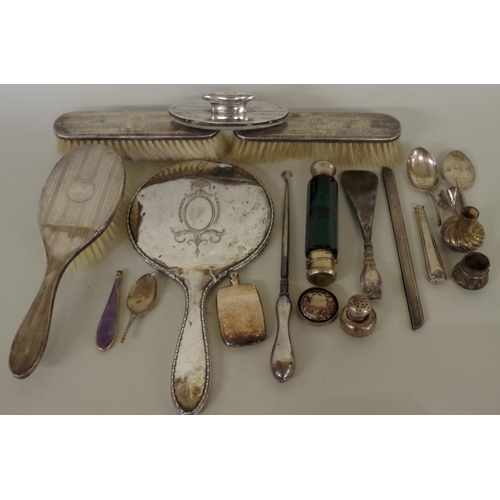 78 - An engine turned silver three piece dressing table brush set; together with a silver hand mirro... 