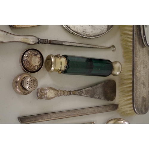 78 - An engine turned silver three piece dressing table brush set; together with a silver hand mirro... 