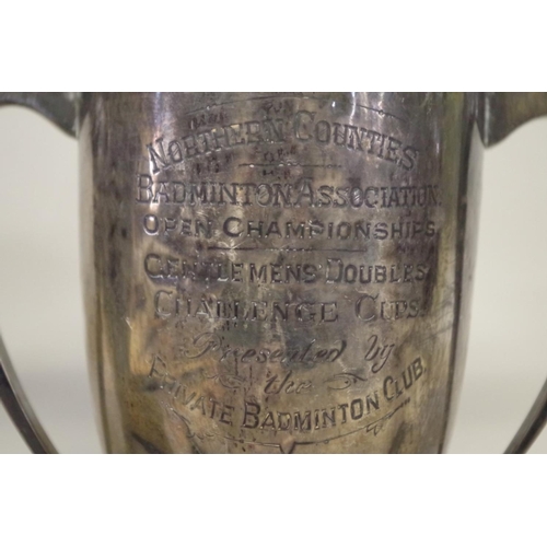 81 - A silver twin handled trophy cup, by Fattorini & Sons, Sheffield 1927, 21cm; together with ... 