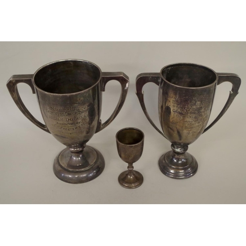 81 - A silver twin handled trophy cup, by Fattorini & Sons, Sheffield 1927, 21cm; together with ... 